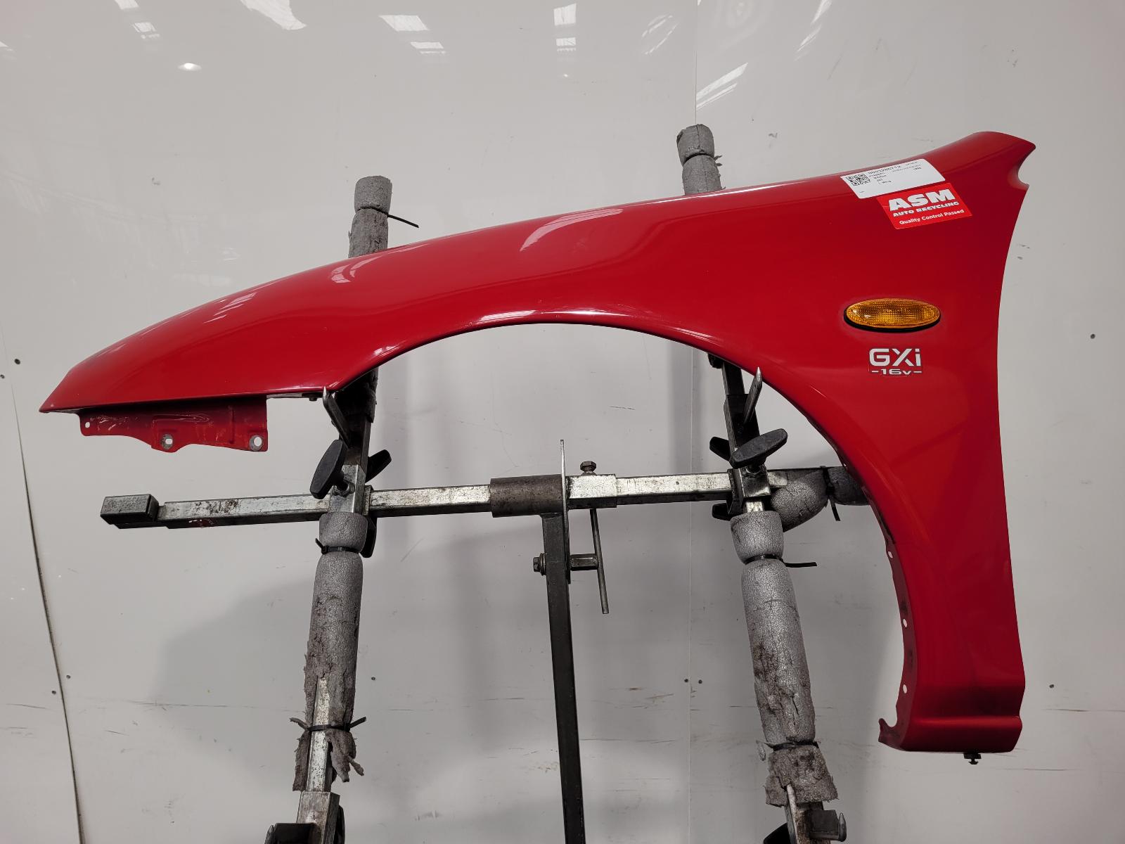 View Auto part L Wing Mazda 323 1996