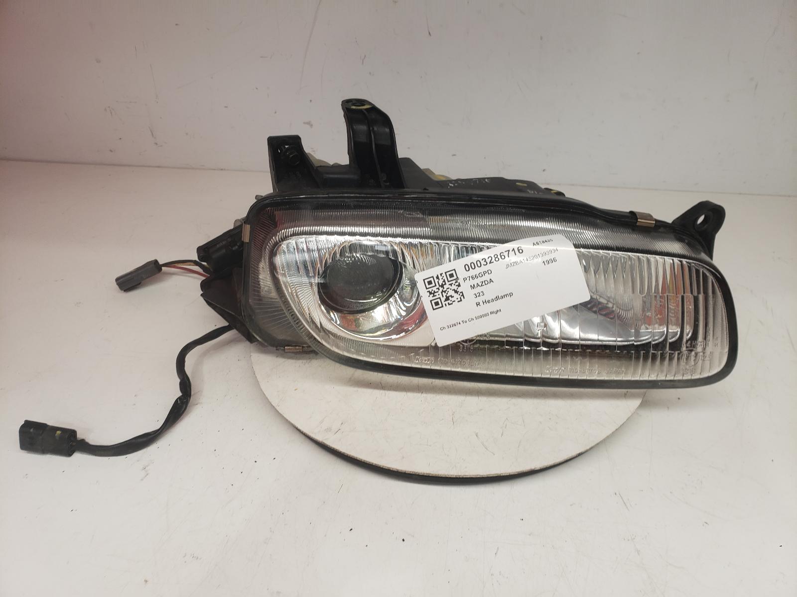 View Auto part R Headlamp Mazda 323 1996